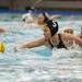 Michigan senior Kiki Golden reaches over a Brown player for a ball in the game on Friday, April 26. Daniel Brenner I AnnArbor.com